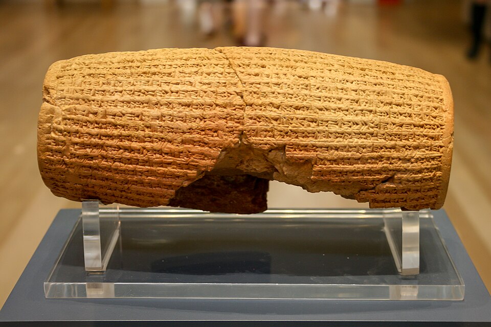 The Cyrus Cylinder, a barrel-shaped clay object covered in cuneiform