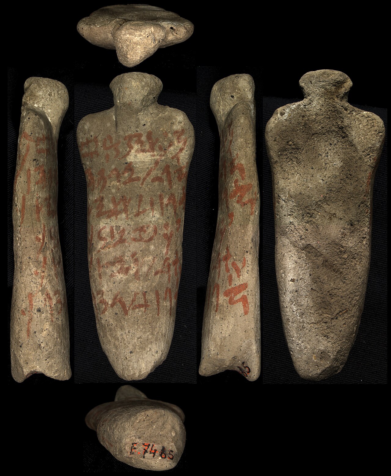 An Egyptian execration figurine of a bound captive, inscribed with names
