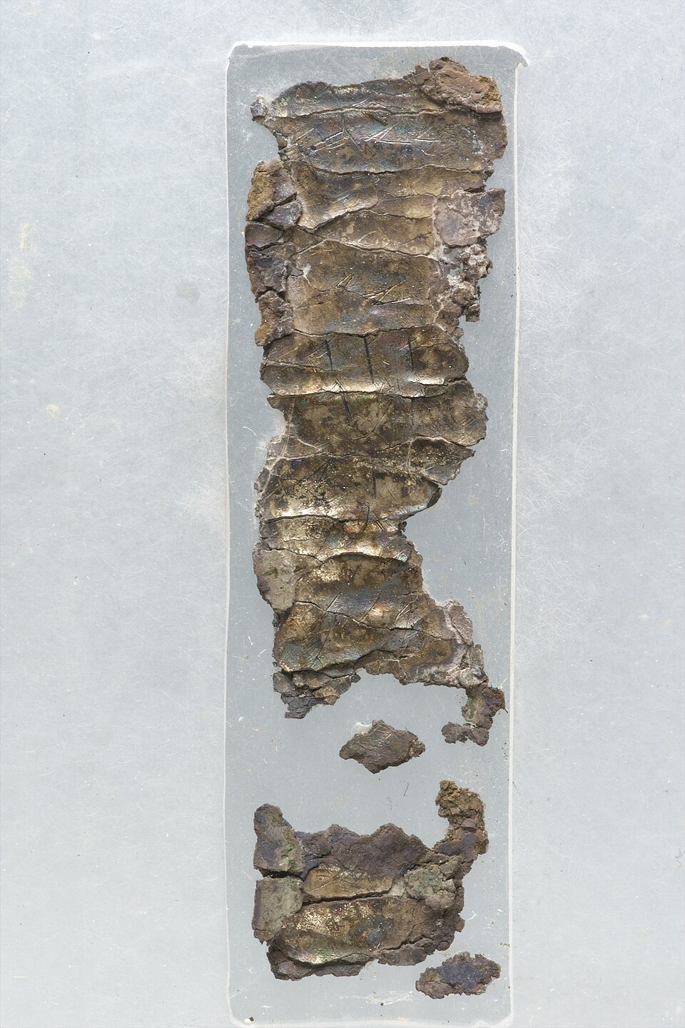 The unrolled Ketef Hinnom silver strips with faint incised Hebrew letters