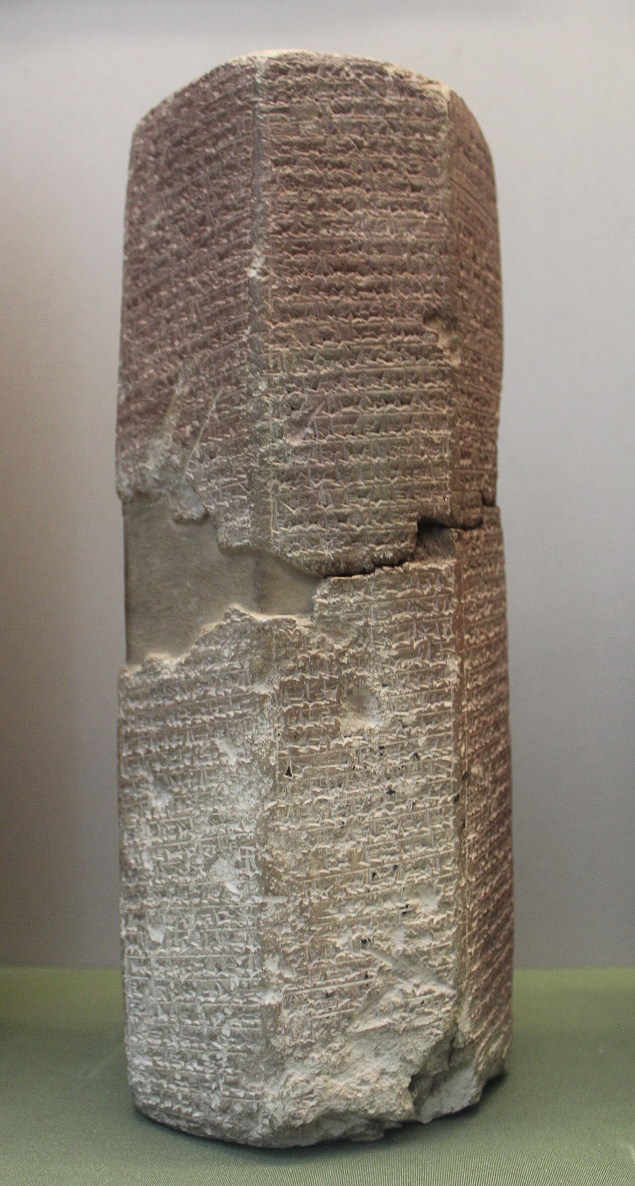 An Assyrian clay prism inscribed with royal annals in cuneiform