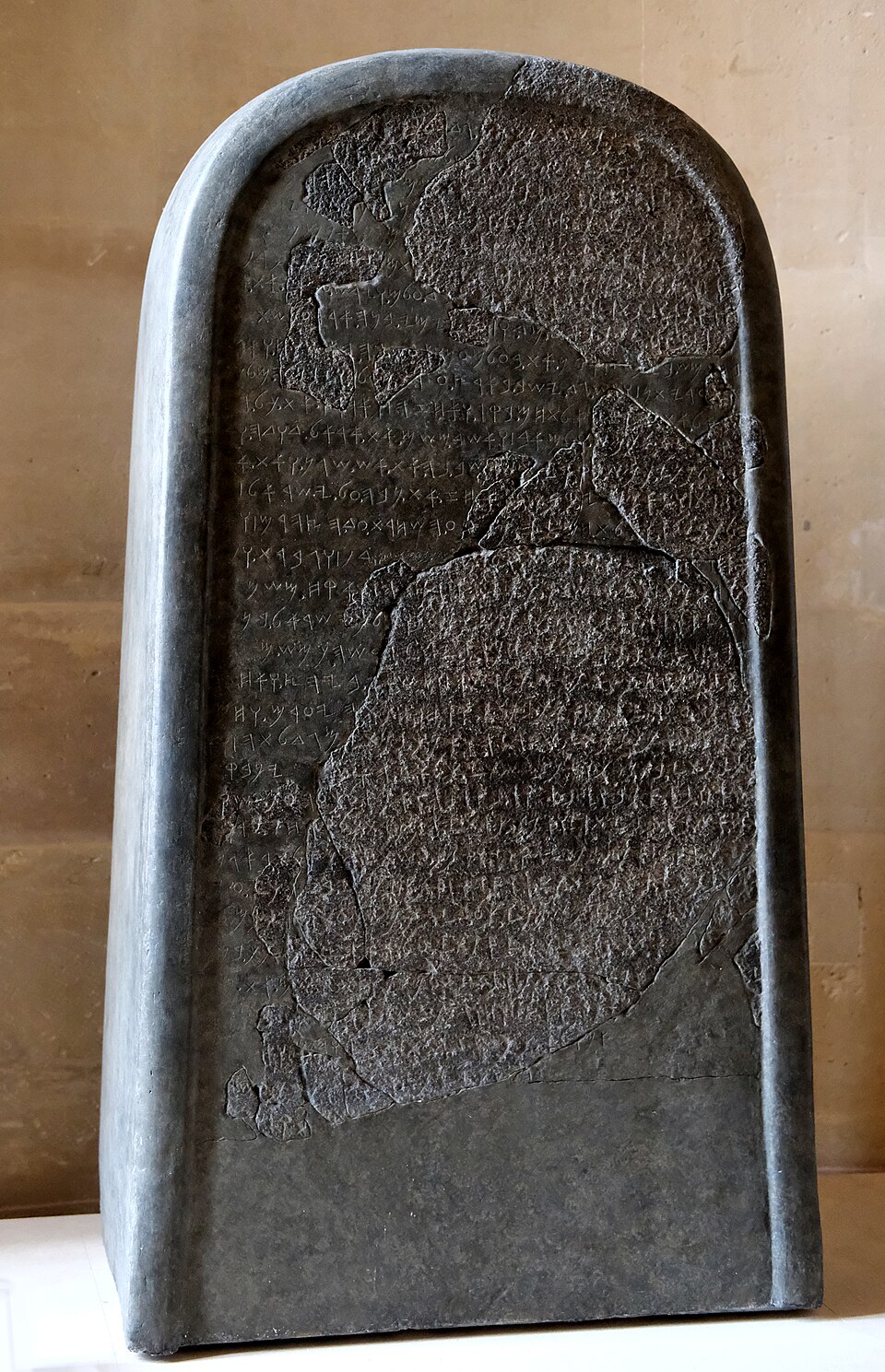 The Mesha Stele, a rounded black basalt slab with Moabite inscription