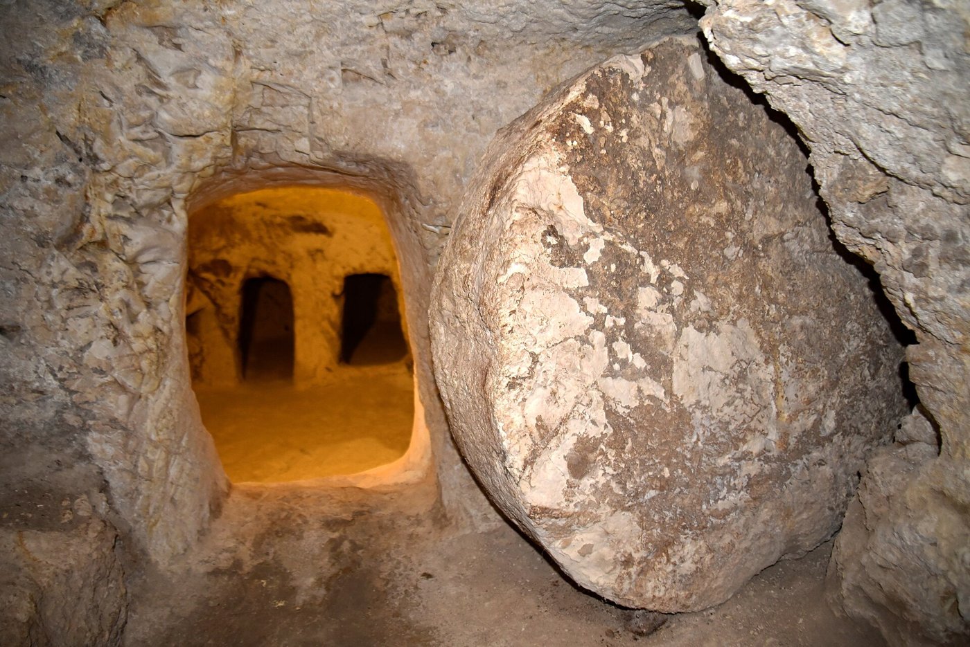 A rock-cut Jewish tomb entrance with its rolling stone in the excavations beneath the Sisters of Nazareth Convent