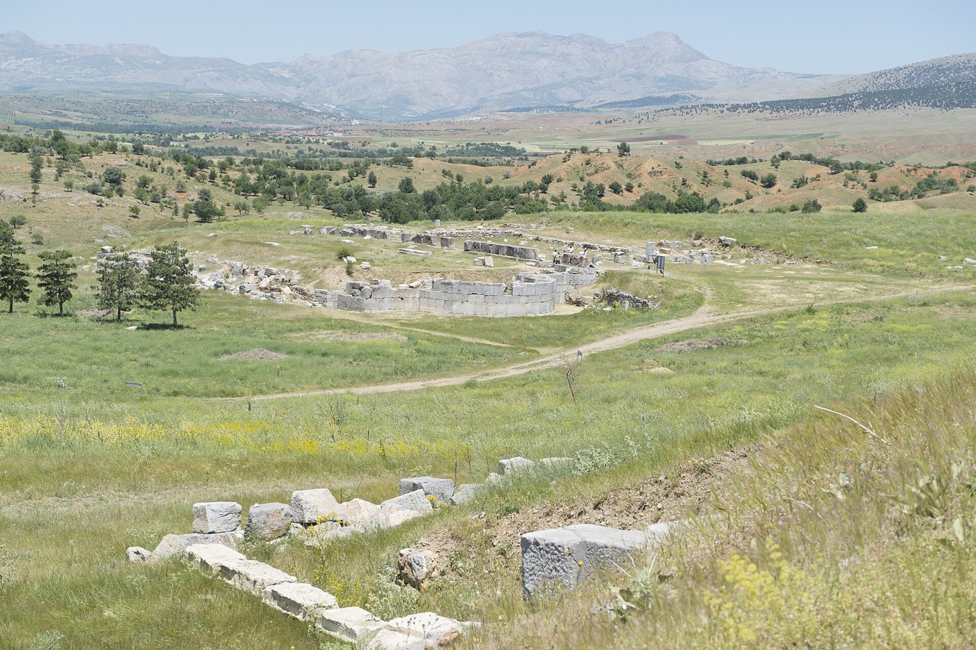 View from the theatre of Pisidian Antioch across the ruins toward the outline of the Great Basilica, with mountains beyond