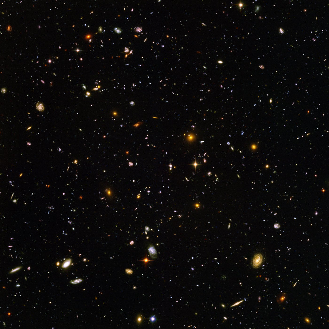 The Hubble Ultra Deep Field, thousands of distant galaxies of varied age, shape and color scattered across a small patch of sky in the constellation Fornax